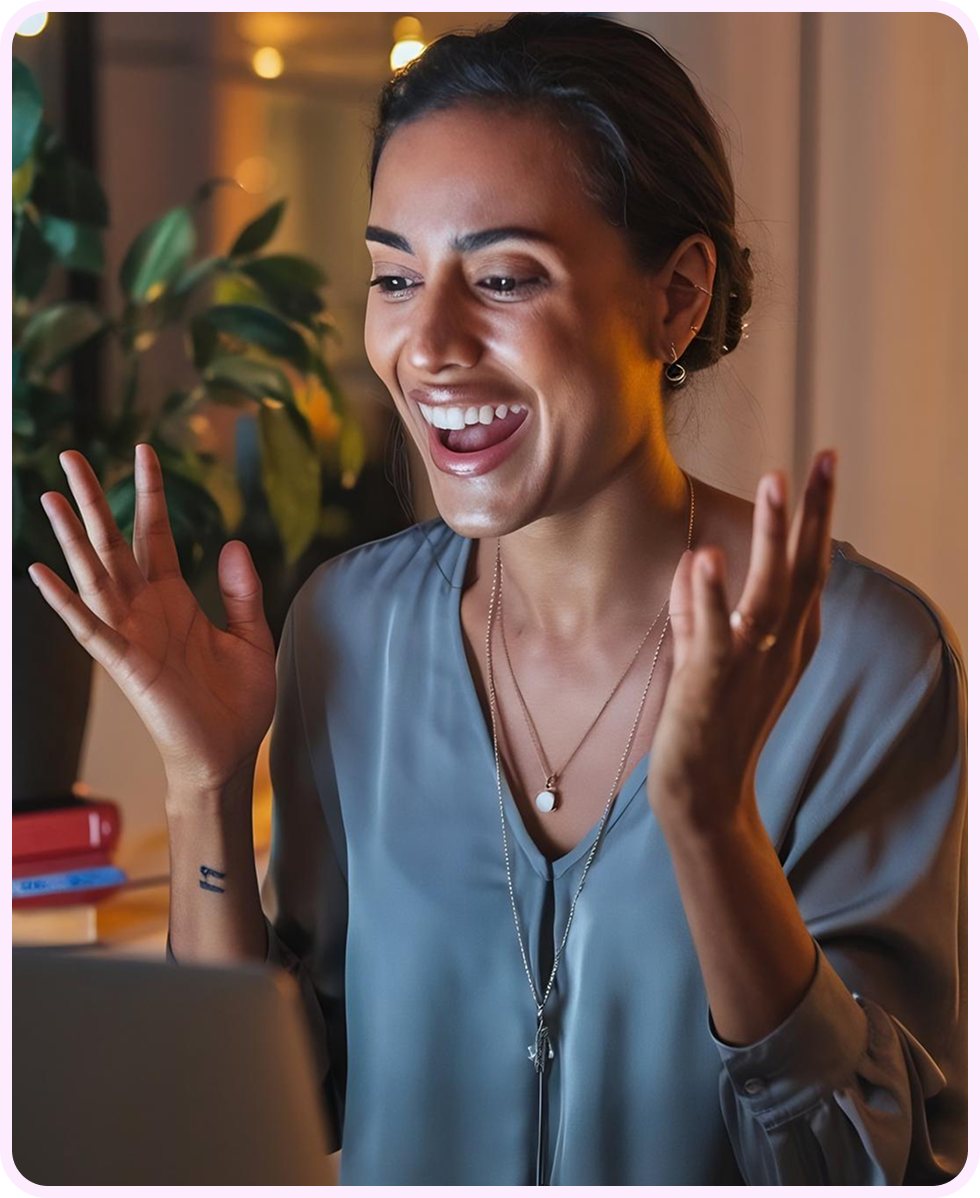 Remote employee smiling during a video call on laptop
