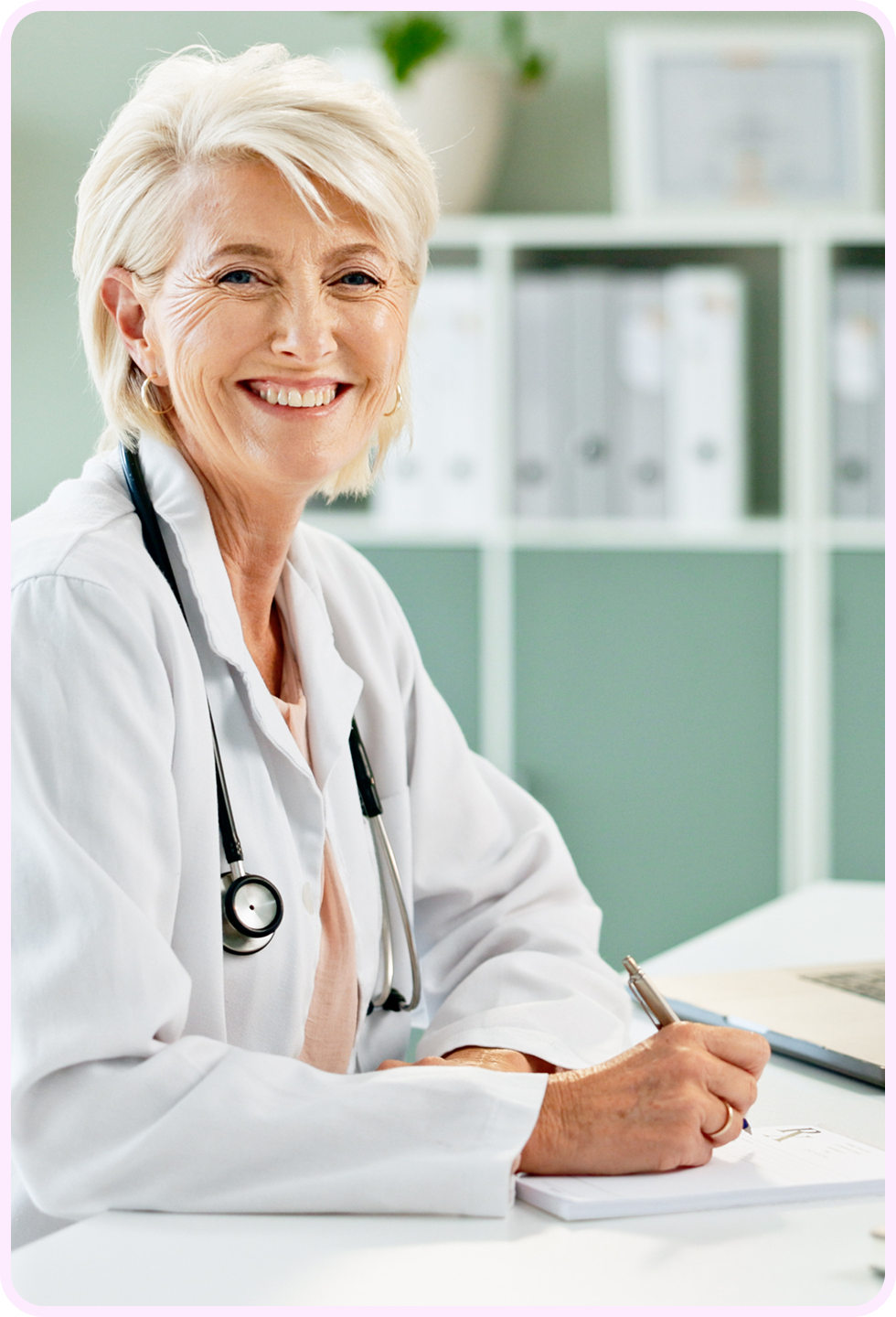 Female doctor smiling at her desk in a medical office