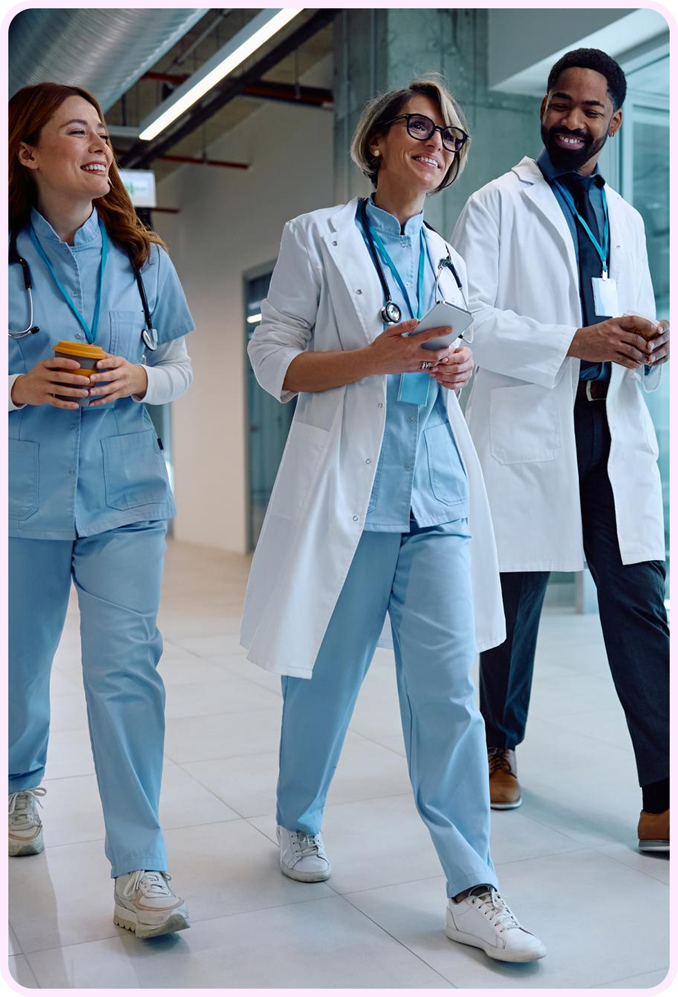 Healthcare professionals walking together in a hospital corridor