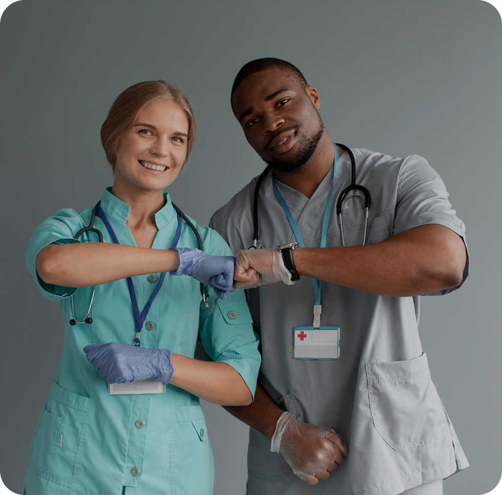 Healthcare professionals giving a fist bump